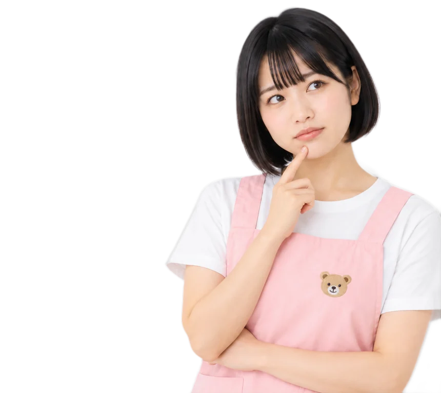 あごに指を当てて考え込む保育士